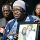 At a press conference on October 5, 2022, Beverly Lane, the victim’s mother, holds a picture of her son for the world to see.